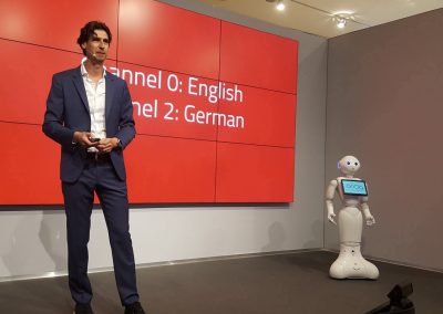 Robot and keynote speaker on stage
