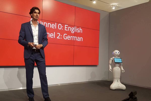 Robot and keynote speaker on stage